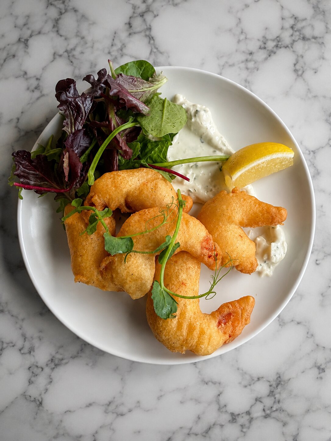 Peroni Tempura Battered King Prawns served with nduja mayo & baby leaf salad.
